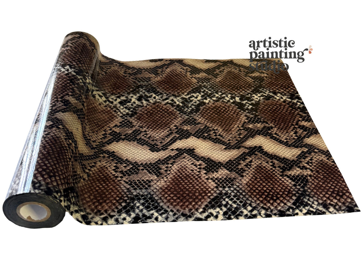 Snakeskin pattern transfer foil roll with 'artistic painting' branding on a white background