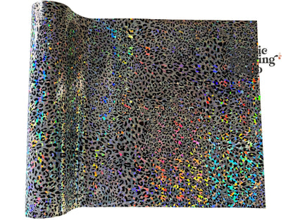 Roll of holographic transfer foil with leopard print pattern on a white background