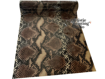 Snakeskin-patterned transfer foil with 'Artistic Painting Studio' branding on a white background