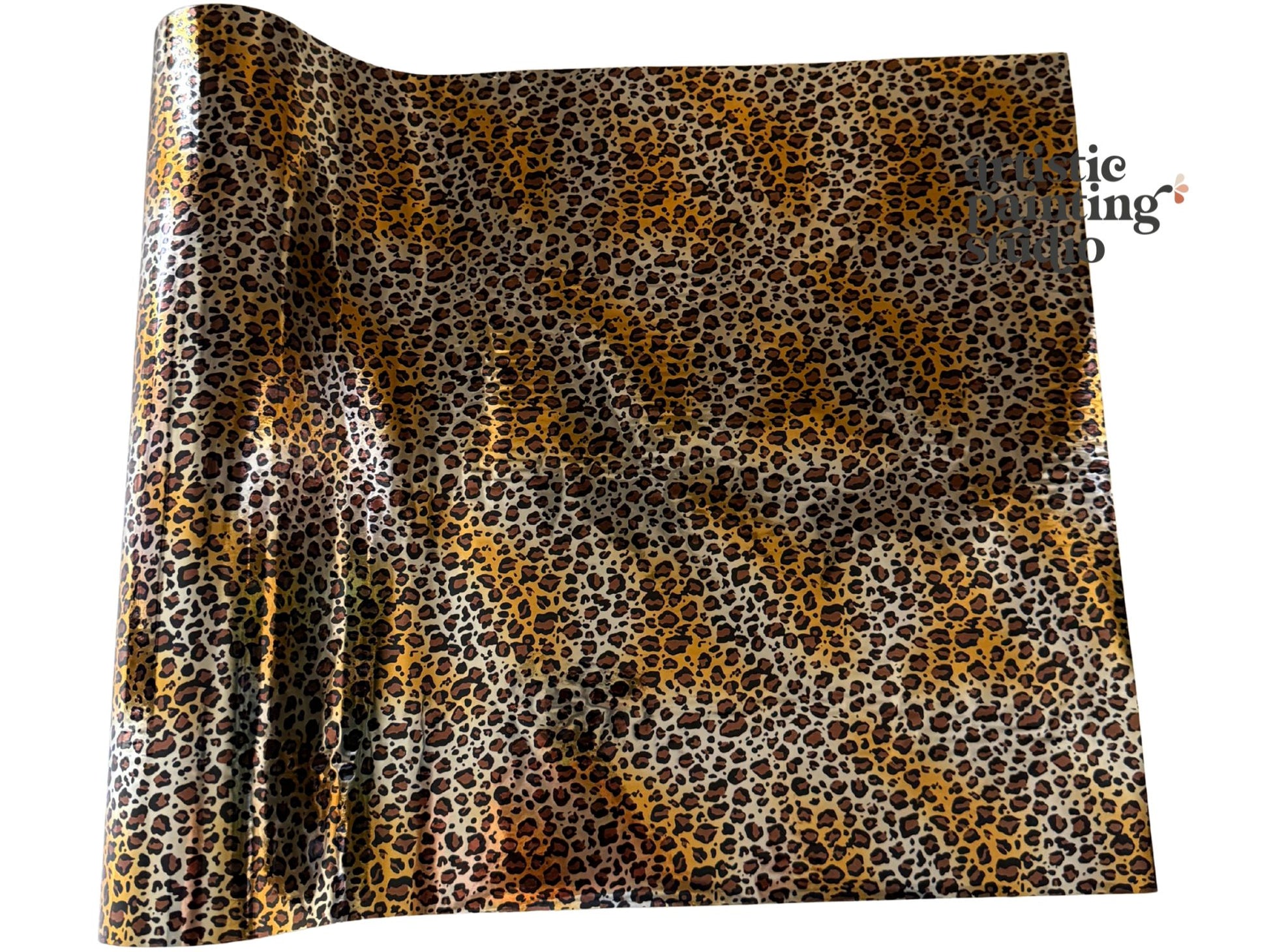 Roll of leopard print transfer foil with visible brand name on a white background