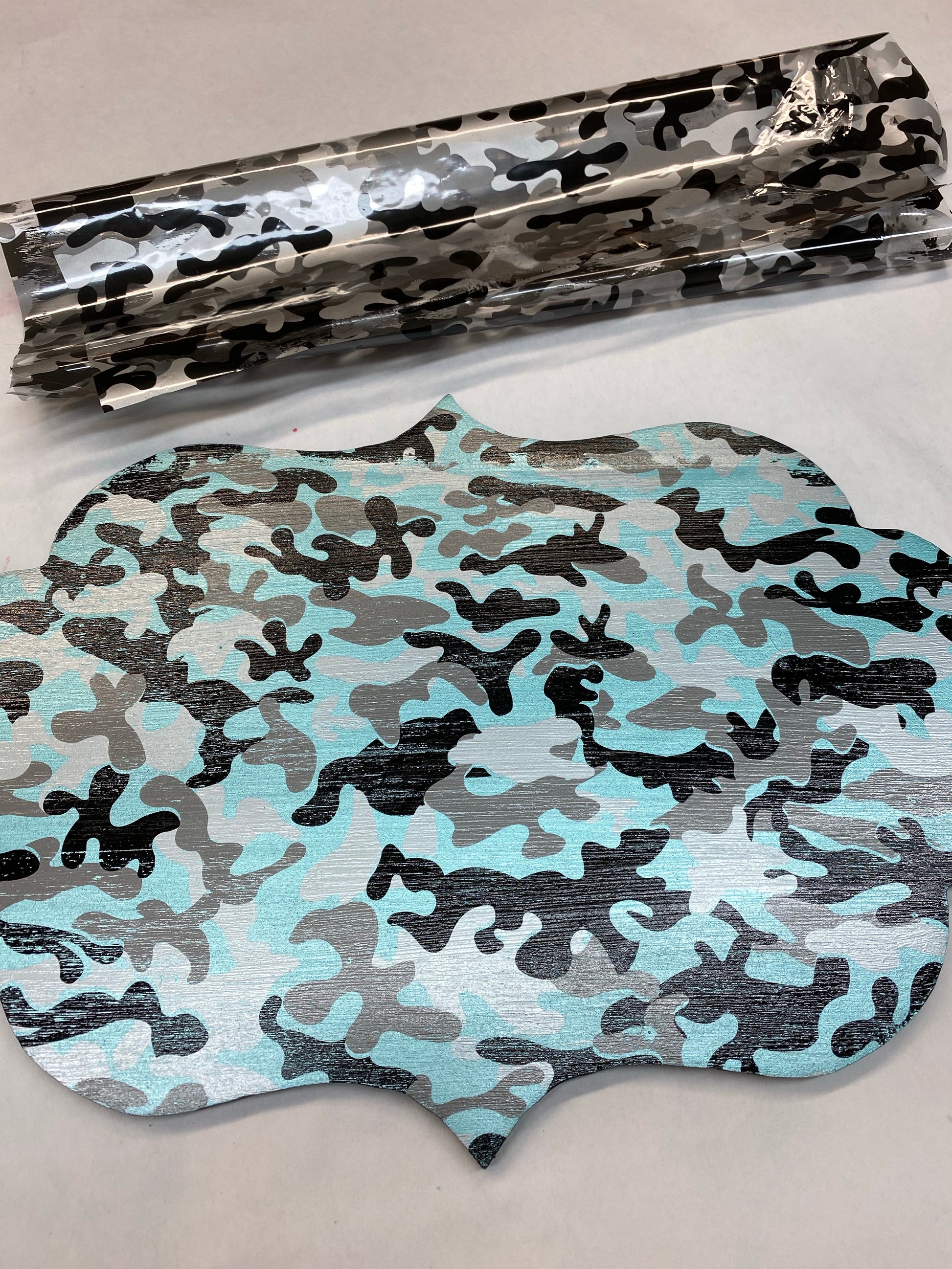 This foil is a Camo pattern with black silver and clear areas - as shown in this picture, you base coat color will show through the transparent/clear areas. 